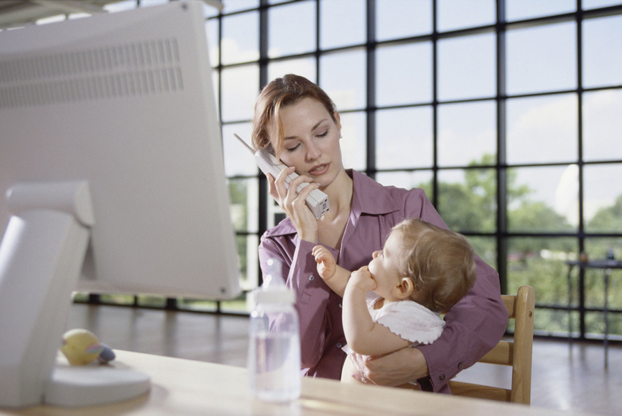 Woman on the phone holding nephew