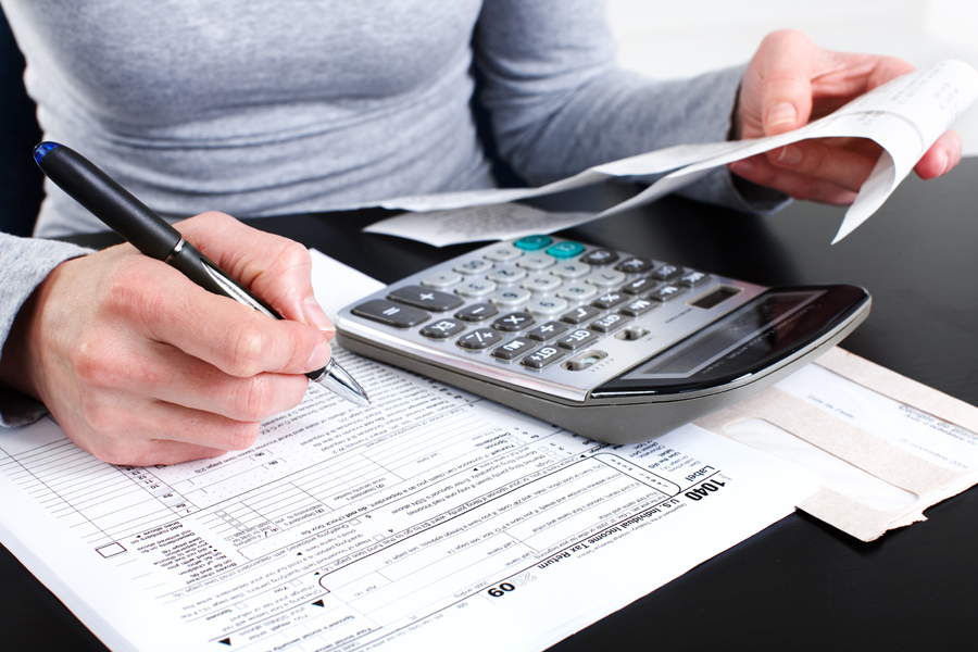 Woman filling out a tax form