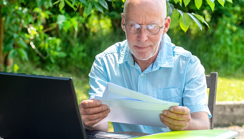 Man looking at a letter