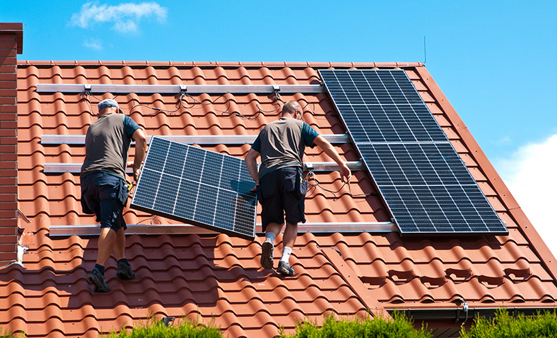 Two Men Installing Solar Panels