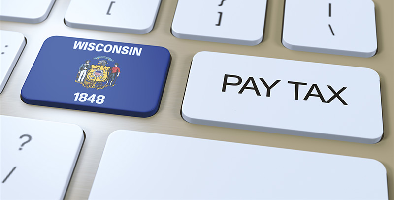 Wisconsin and Pay Tax keys on a keyboard