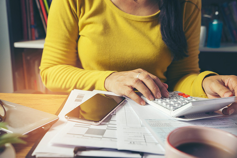 Woman looking at tax paperwork