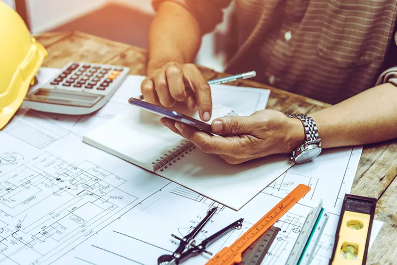 construction business owner starting to dial his phone