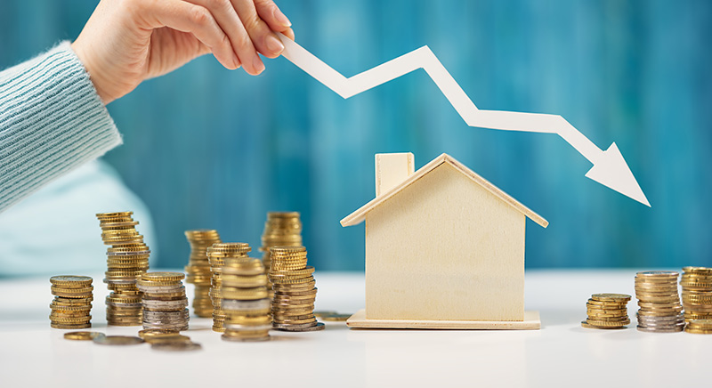 House with downward arrow above it with coins surrounding it.