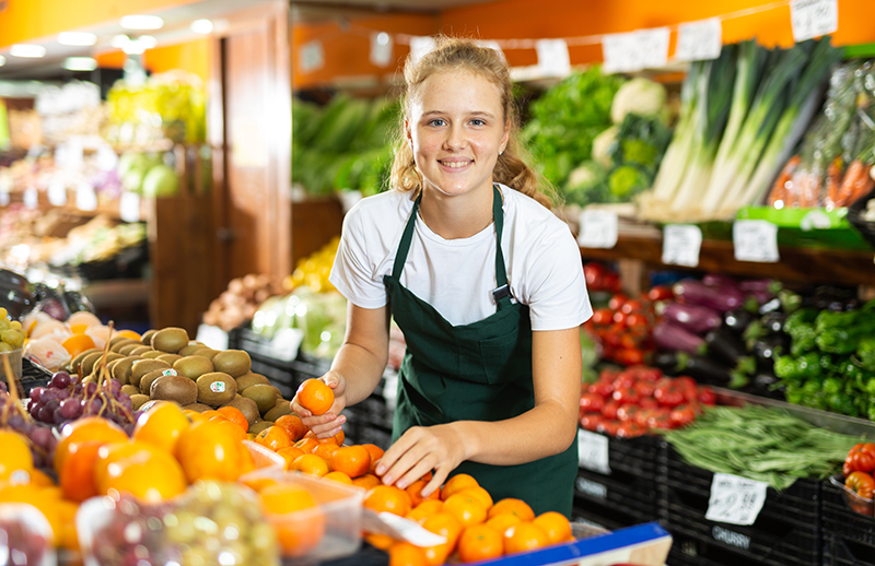 Teenager Working at Grocery Store