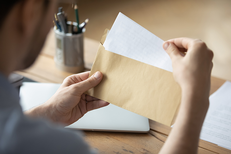 Man opening letter