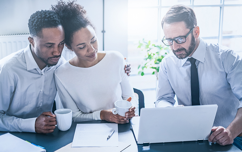 Tax Professional going over audit letter with couple