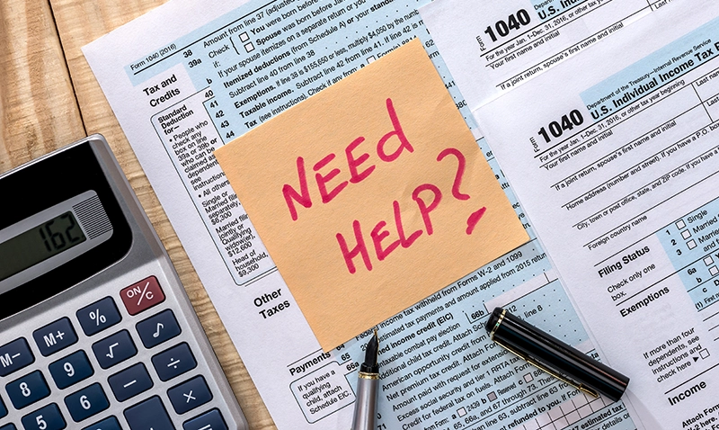 Need Help? Written on a sticky note