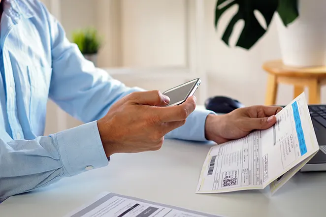 Man scanning a document with his phone