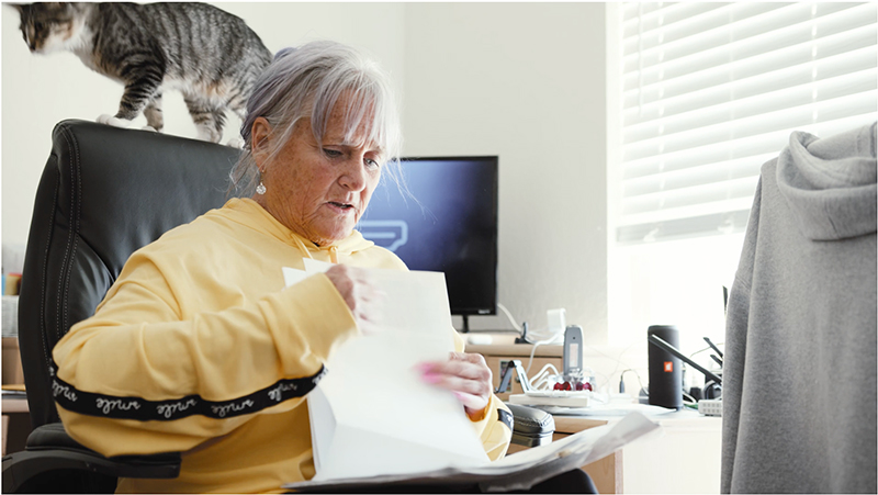 Woman looking at tax paperwork