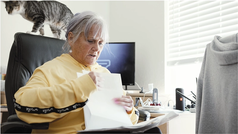 Woman looking at tax paperwork