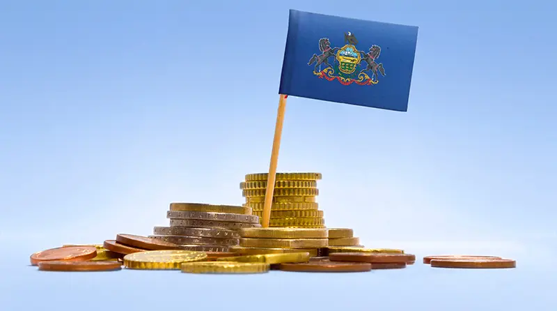 Pennsylvania Flag on a pile of money